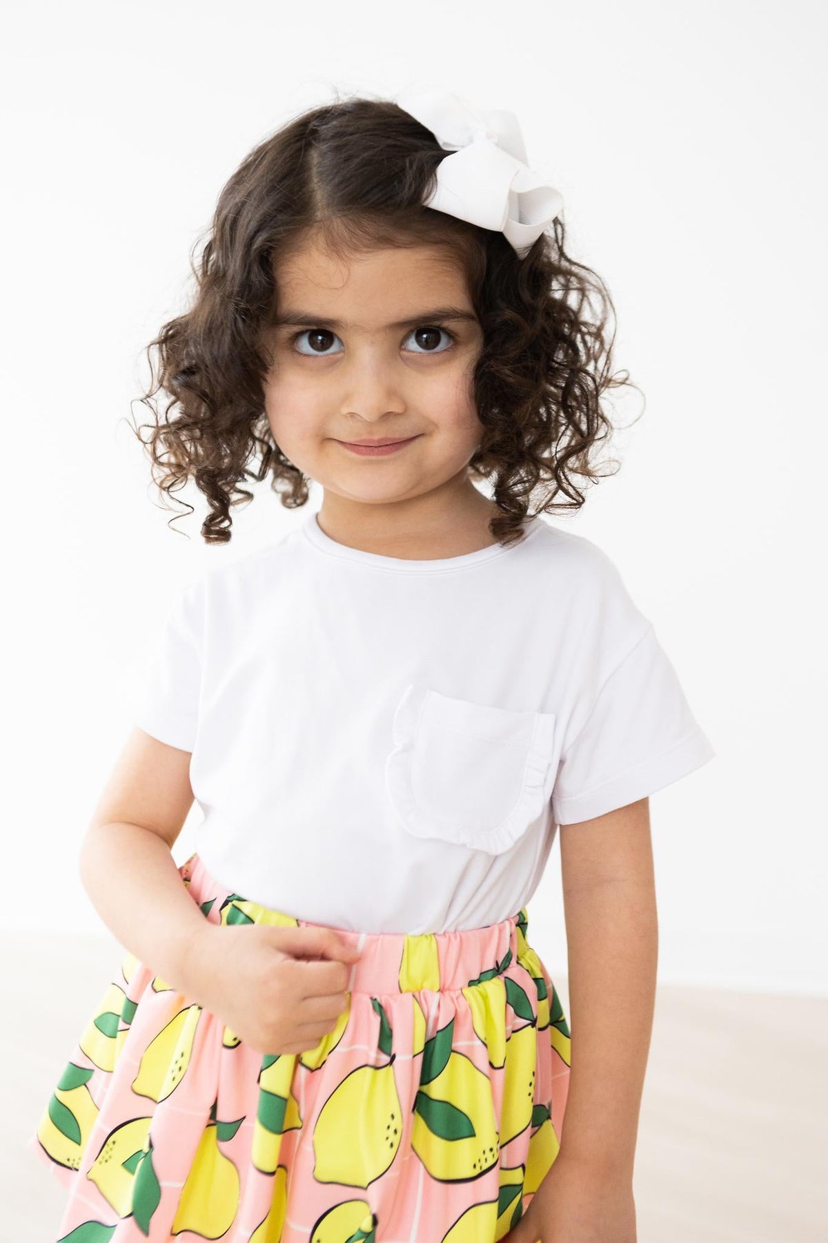 MILA & ROSE: WHITE RUFFLE POCKET TEE