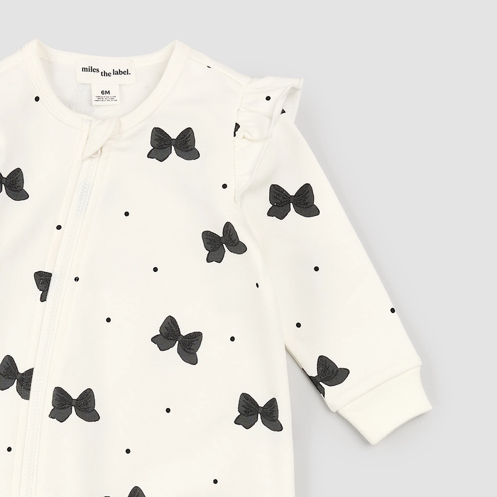 MILES THE LABEL: GLITTER BOW PRINT ON OFF-WHITE PLAYSUIT