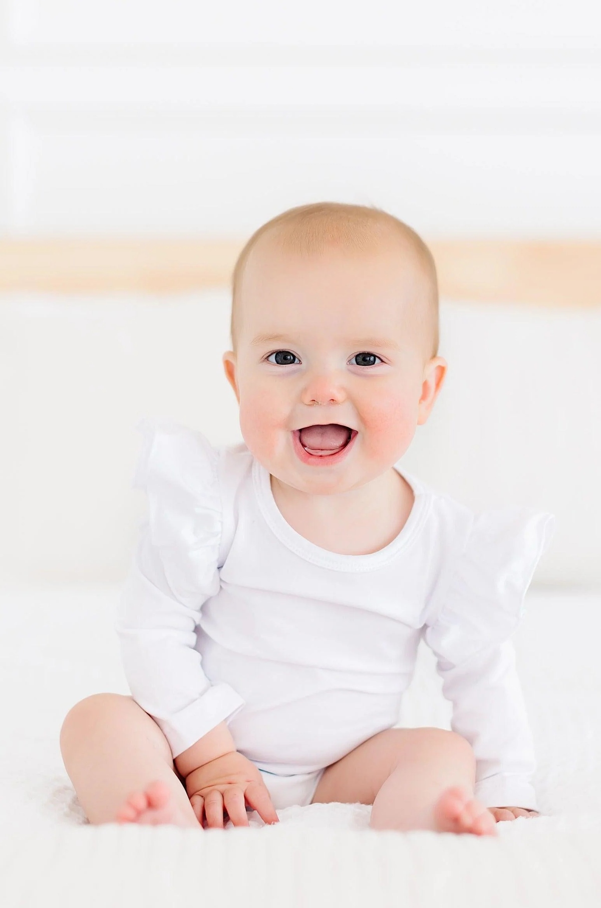 MILA & ROSE: WHITE LONG SLEEVE FLUTTER BODYSUIT - WHITE