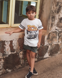 TINY WHALES: KEEP ON TRUCKIN' FOOTBALL TEE - PARCHMENT/VINTAGE BLACK