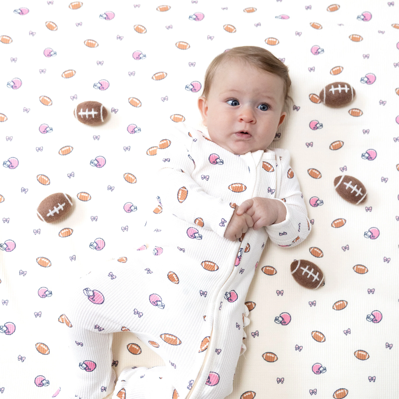 ANGEL DEAR: 2 WAY ZIPPER RUFFLE BACK FOOTIE - FOOTBALLS AND BOWS