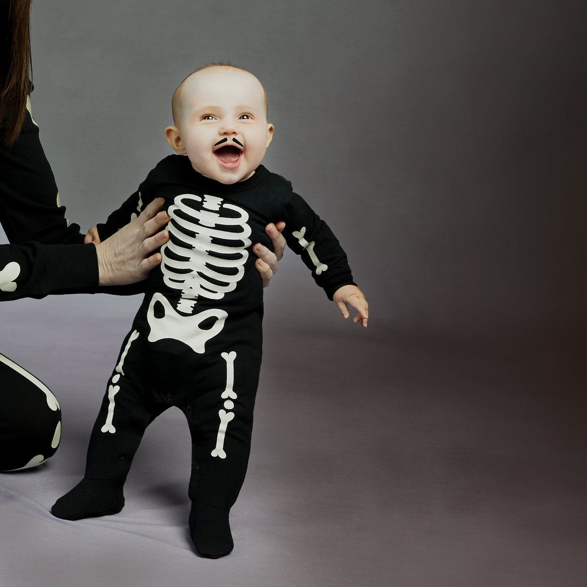 PETIT LEM: SKELETON GLOW IN THE DARK PRINT SLEEPER - BLACK