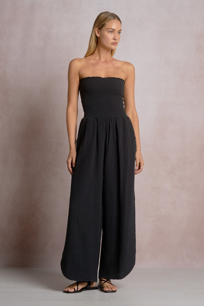 ELAN: SMOCKED STRAPLESS SIDE SLIT JUMPSUIT - BLACK