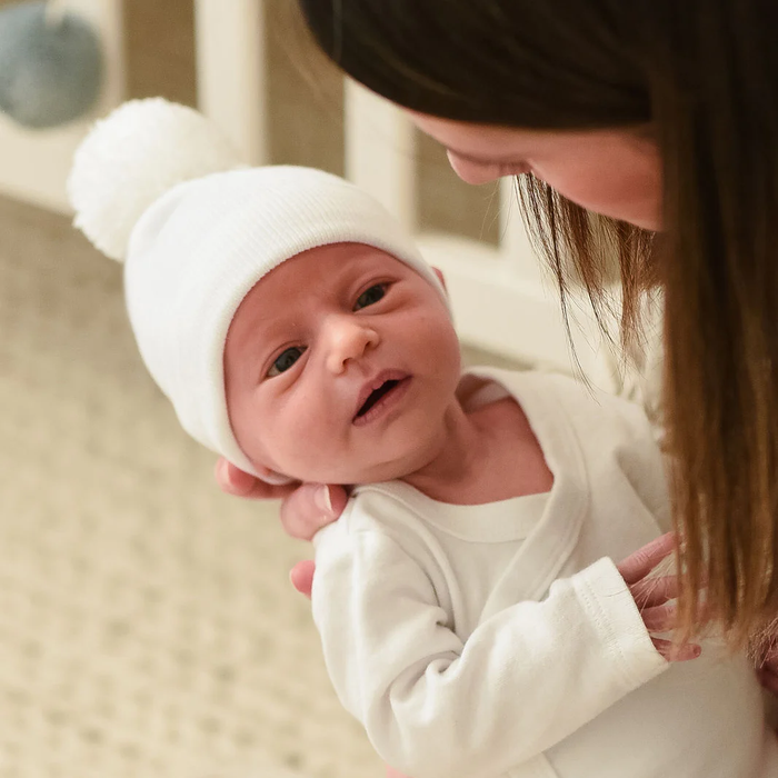 ILYBEAN: SOLID WHITE NEWBORN HOSPITAL HAT WITH WHITE POM POM - GENDER NEUTRAL